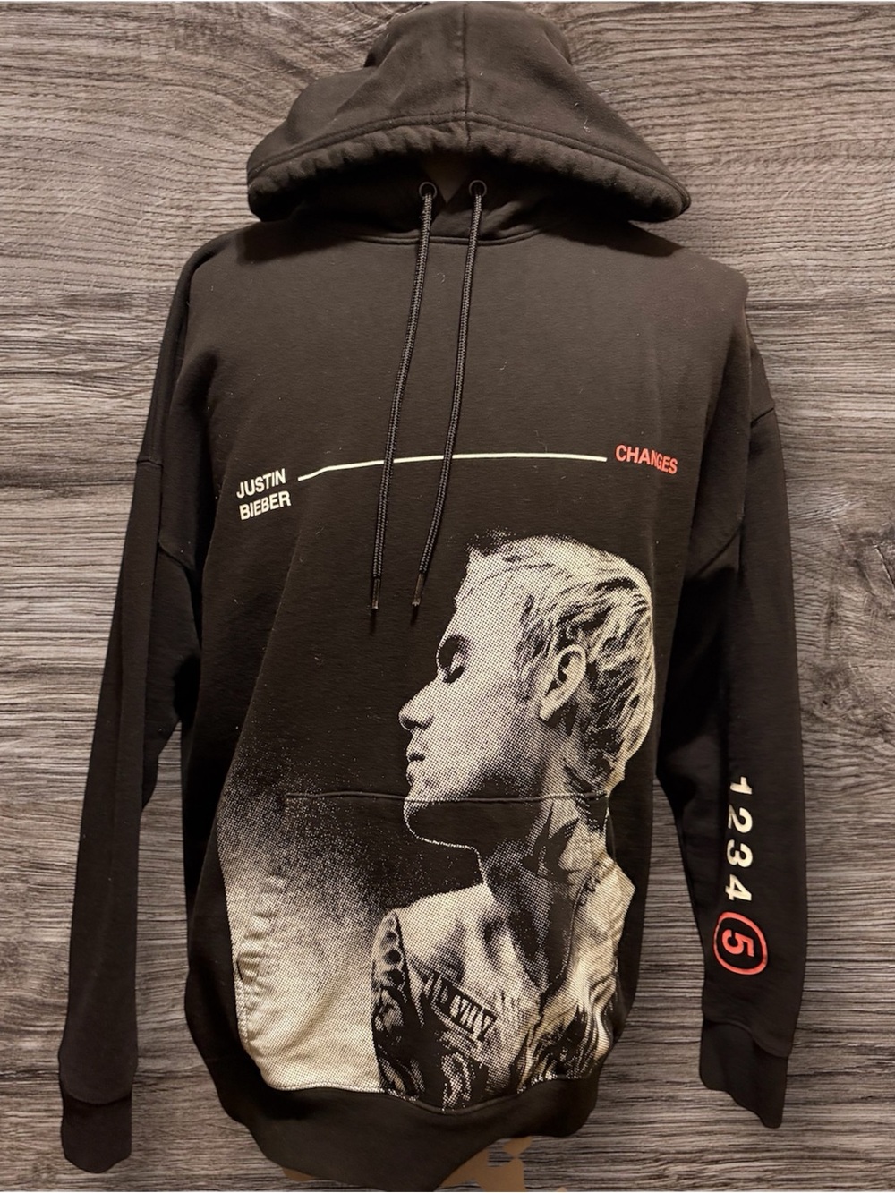 H&M Black Graphic Hoodie with White Portrait and Red Accents